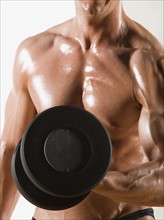 Male body builder flexing lifting weight. Date : 2008