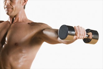 Male body builder flexing lifting weight. Date : 2008