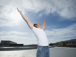 Man with arms raised. Date : 2008