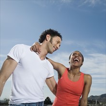 Multi-ethnic couple laughing. Date : 2008