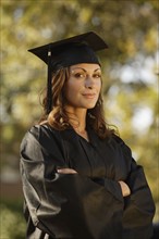 Woman graduate with arms crossed. Date : 2008