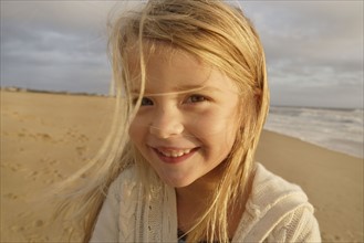 Girl laughing at beach. Date : 2008