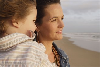 Mother and daughter at beach. Date : 2008