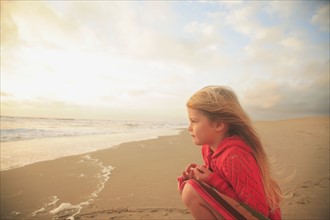 Girl sitting on beach. Date : 2008