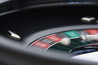 Close up of spinning roulette table.