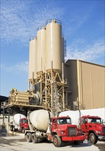 Cement trucks parked at cement plant. Date : 2008