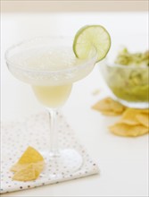 Lime margarita, tortilla chips and guacamole. Date : 2008