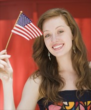 Young woman holding American flag. Date : 2008