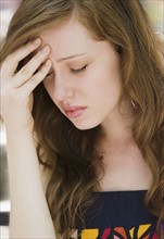 Young woman with headache. Date : 2008