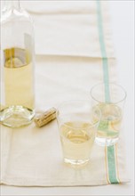 Glasses of white wine and wine bottle. Date : 2008