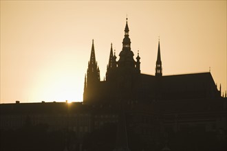 Sunset over silhouetted cathedral.