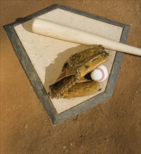 Baseball equipment on home plate.
