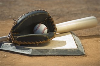 Baseball equipment on home plate.