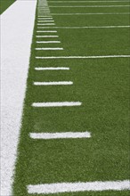 Yard line markers on football field.