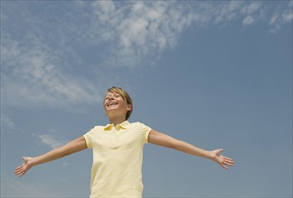 Girl with arms outstretched.