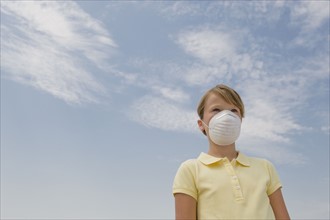 Girl wearing dust mask.
