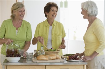 Senior women preparing food.
