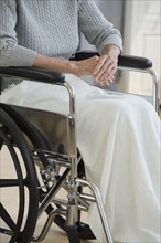 Senior woman sitting in wheelchair.