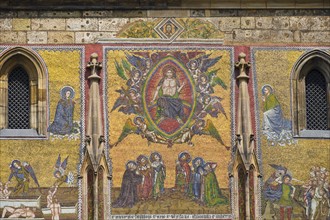 Religious mosaic on cathedral wall.
