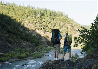 Hikers admiring view of river. Date : 2008