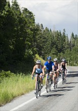 Cyclists in a row on mountain road. Date : 2008