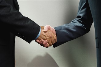 Businessmen shaking hands. Date : 2008