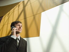 Businessman talking on cell phone. Date : 2008
