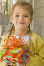Girl holding gift. Date : 2008