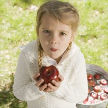 Girl bobbing for apples. Date : 2008
