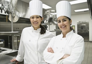 Female chefs posing in kitchen. Date : 2008