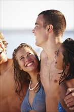 Young couples laughing on beach. Date : 2008