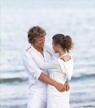 Young couple hugging on beach. Date : 2008