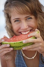 Young woman eating watermelon. Date : 2008