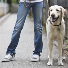 Girl walking dog. Date : 2008