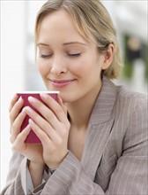 Businesswoman enjoying coffee. Date : 2008
