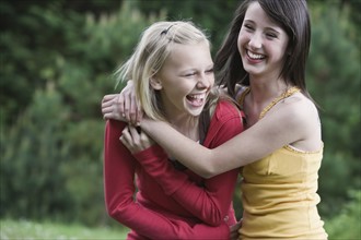 Girls laughing in park. Date : 2008