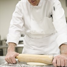 Baker rolling dough. Date : 2008