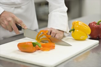 Chef chopping bell peppers. Date : 2008