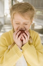 Girl eating apple porch. Date : 2008