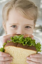 Girl eating sandwich. Date : 2008