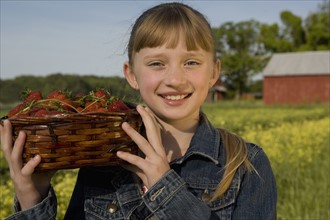 Girl picking strawberries. Date : 2008