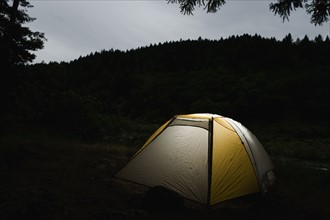 Tent illuminated at night. Date : 2008