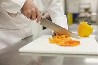 Close up of chef chopping bell pepper. Date : 2008