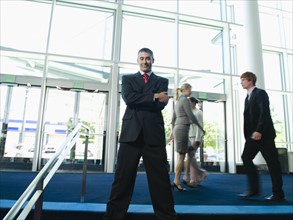 Confident businessman posing in lobby. Date : 2008