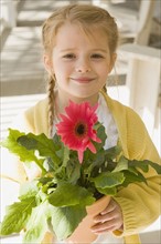 Girl holding flower. Date : 2008