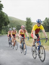 Cyclists in a row on country road. Date : 2008