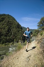 Man running on riverside trail. Date : 2008