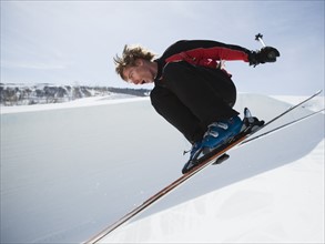 Skier jumping off lip of half-pipe. Date : 2008