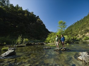 Hikers stranded on rock in middle of river. Date : 2008