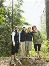 Female hikers posing in forest. Date : 2008